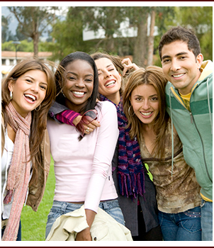 Group of happy high school students outside